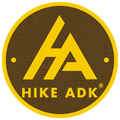 Round Hike ADK logo sticker with brown yellow and topographic details